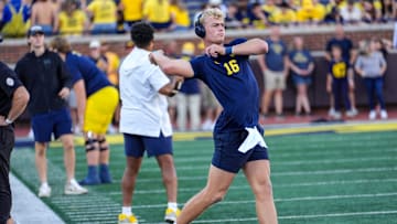 Michigan quarterback Davis Warren (16) warms up before the start before the game against Fresno State at Michigan Stadium in Ann Arbor on Saturday, Aug. 30, 2024.