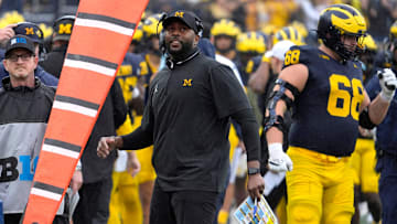 Michigan football coach Sherrone Moore looks up at the scoreboard after his team got a fumble recovery during first-half action between Michigan and Minnesota at Michigan Stadium in Ann Arbor on Saturday, Sept. 28, 2024.