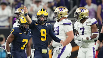 Michigan quarterback J.J. McCarthy points down the field during the second half of the College Football Playoff national championship game against Washington at NRG Stadium in Houston, Texas on Monday, Jan. 8, 2024.