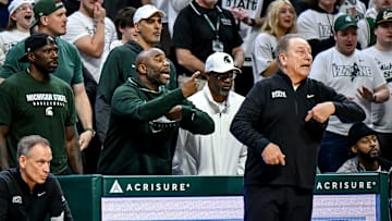 From left, former Michigan State players Jason Richardson, Mateen Cleaves, former assistant coach Mike Garland and Mo Peterson, sit behind Tom Izzo during the second half in the game against Oregon on Saturday, Feb. 8, 2025, at the Breslin Center East Lansing.