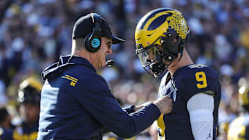 Michigan coach Jim Harbaugh talks to quarterback J.J. McCarthy before the start of the Rose Bowl vs. Alabama in Pasadena, California, on Monday, Jan. 1, 2024.