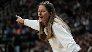 UofM's Head Women's Basketball Coach Kim Barnes Arico talks to her team during the Michigan State game at the Breslin Center Sunday, Feb. 9, 2025. Michigan won 71-61.