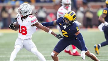 Michigan defensive back Will Johnson defends Ohio State receiver Marvin Harrison Jr. during the second half at Michigan Stadium in Ann Arbor on Saturday, Nov. 25, 2023.