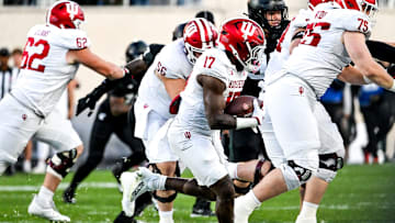 Indiana's Ty Son Lawton runs for a gain against Michigan State during the third quarter on Saturday, Nov. 2, 2024, at Spartan Stadium in East Lansing.