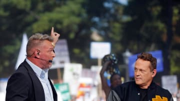 ESPN's Pat McAfee, left, points toward \"Touchdown Jesus\" while picking Notre Dame to beat Ohio State during \"College GameDay\" Saturday at Notre Dame.