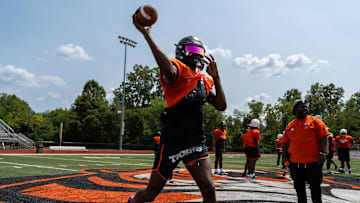 Quarterback Bryce Underwood throws a pass during a team practice at the Belleville High School football field in Belleville on Wednesday, Aug. 14, 2024.
