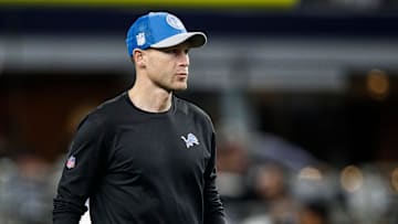 Detroit Lions offensive coordinator Ben Johnson watches warm up before the Dallas Cowboys game at