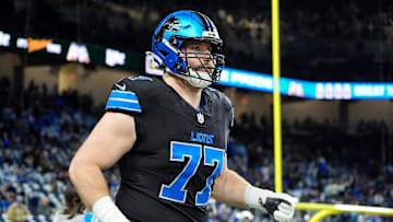 Detroit Lions center Frank Ragnow (77) warm up before the game between Detroit Lions and Buffalo Bills at Ford Field in Detroit on Sunday, Dec. 15, 2024.
