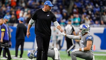 Detroit Lions head coach Dan Campbell fist bumps receiver Tom Kennedy during warmups before the game vs. the Miami Dolphins at Ford Field in Detroit on Sunday, Oct. 30, 2022.