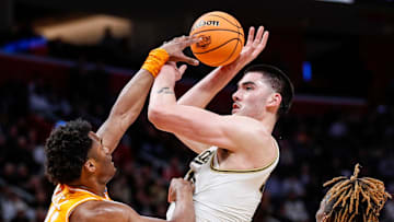 Purdue center Zach Edey (15) makes a jump shot against Tennessee forward Tobe Awaka (11) during the first half of the NCAA tournament Midwest Regional Elite 8 round at Little Caesars Arena in Detroit on Sunday, March 31, 2024.