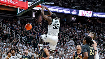 Michigan State's Coen Carr makes an alley-oop dunk against Purdue.