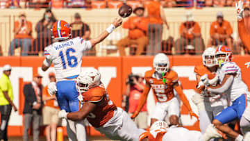 Texas Longhorns defensive lineman Alfred Collins (95) attempts to tackle Florida Gators quarterback Aidan Warner (16) during the Longhorns' game against the Florida Gators, Nov. 9, 2024 at Darrell K. Royal Texas Memorial Stadium in Austin.