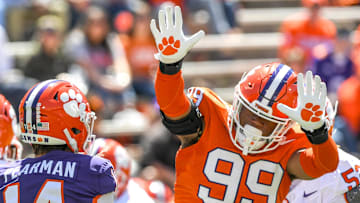 Clemson defensive end A.J. Hoffler (99) pressures Clemson quarterback Trent Pearman (14) during the Spring football game in Clemson, S.C. Saturday, April 6, 2024.