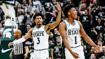 Michigan State's Jaden Akins, left, and Jeremy Fears Jr. celebrate after a play against Wisconsin during the second half on Sunday, March 2, 2025, at the Breslin Center in East Lansing.