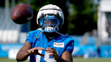 Detroit Lions wide receiver Donovan Peoples-Jones catches footballs from the JUGS machine after practice at the Detroit Lions practice facility in Allen Park on Friday, July 26, 2024