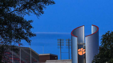 The Clemson Memorial Stadium Oculus with a glowing Tiger paw as the sun set on Clemson in September.

Clemson Football Gather With Clemsonlife