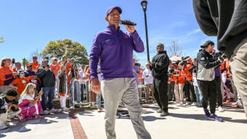 Apr 6, 2024; Clemson, South Carolina, USA; Clemson Tigers head coach Dabo Swinney (middle) talks about honoring former team captains Hamp Greene, Jonathan Weitz, Tyler Davis, Will Shipley, Will Putnam, and Justin Mascoll during Tiger Walk before the Clemson spring football game at Memorial Stadium. Mandatory Credit: Ken Ruinard-USA TODAY Sports