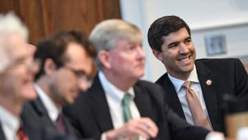 Graham Neff, right,Clemson University Athletic Director smiles as Judge Perry H. Gravely, rules on the university's motion for summary judgement and the conference's motion to dismiss, at the Pickens County Courthouse in Pickens, S.C. Friday, July 12, 2024.