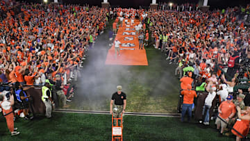 Sep 16, 2023; Clemson, South Carolina; Clemson head coach Dabo Swinney leads players running down the hill after rubbing Howard's Rock at the top, before the game with Florida Atlantic at Memorial Stadium.  Mandatory Credit: Ken Ruinard-USA TODAY NETWORK