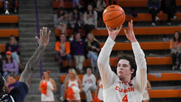 Clemson senior forward Ian Schieffelin (4) scores near Radford forward Josiah Harris (5) during the second half at Littlejohn Coliseum Thursday, November 21, 2024; Clemson, SC, USA.