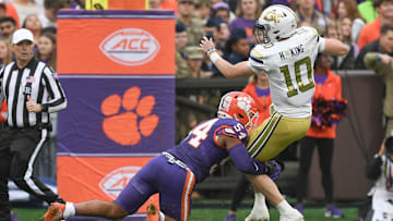 Nov 11, 2023; Clemson, South Carolina, USA; Clemson Tigers linebacker Jeremiah Trotter Jr. (54) sacks Georgia Tech Yellow Jackets quarterback Haynes King (10) during the second quarter at Memorial Stadium. Mandatory Credit: Ken Ruinard-Imagn Images