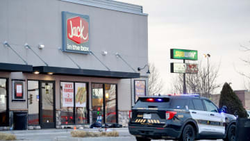 Pueblo police cordon off a scene at the US Highway 50 Jack in the Box location where an employee was