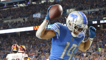 Detroit Lions wide receiver Amon-Ra St. Brown celebrates his touchdown catch against the Washington