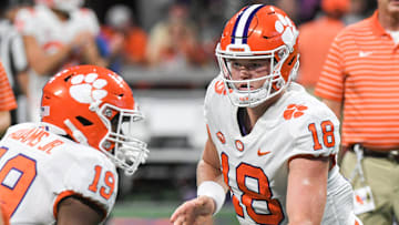 Clemson quarterback Hunter Helms (18) hands the ball to running back Keith Adams Jr (19) during warm ups before the game at the Mercedes-Benz Stadium in Atlanta, Georgia Monday, September 5, 2022.