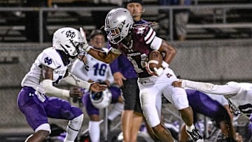Mt. Whitney's Israel Briggs runs against Mission Oak in non-league high school football on Friday, September 13, 2024.