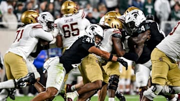 Michigan State's David Santiago, left, tackles Boston College's Turbo Richard during the second quarter on Saturday, Sept. 6, 2025, at Spartan Stadium in East Lansing.