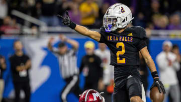 Warren De La Salle's Damion King IV points at the end zone after getting a first down against Muskegon's defense during the Division 2 football state championship game at Ford Field in Detroit on Saturday, Nov. 25, 2023.