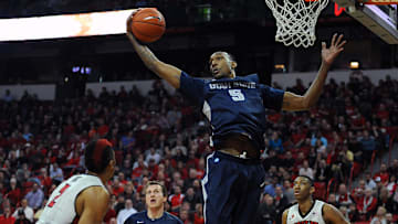 Jan 22, 2014; Las Vegas, NV, USA; Utah State Aggies center Jarred Shaw (5) jumps to grab a rebound during an NCAA men's basketball game against the UNLV Runnin' Rebels at Thomas & Mack Center. Mandatory Credit: Stephen R. Sylvanie-Imagn Images