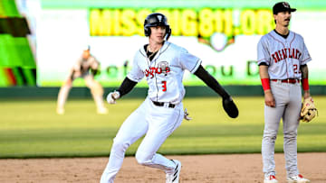 Lugnuts' Henry Bolte advances to second base against the Loons during the fifth inning on Tuesday, April 9, 2024, at Jackson Field in Lansing.