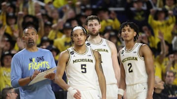(From left) Michigan coach Juwan Howard, forward Terrance Williams II, center Hunter Dickinson and guard Kobe Bufkin look on during U-M's 60-56 win on Sunday, Jan. 22, 2023, at Crisler Center.

Mich Minn 012223 Kd 1938