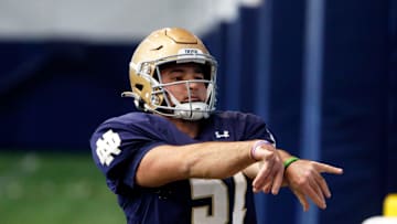 Notre Dame junior long snapper Rino Monteforte works through a drill at football practice Wednesday, March 27, 2024, at the Irish Athletics Center in South Bend.