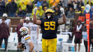 CAROLINA PANTHERS: Michigan defensive lineman Mason Graham celebrates after sacking Minnesota quarterback Max Brosmer, in the background, during first-half action between Michigan and Minnesota at Michigan Stadium in Ann Arbor on Saturday, Sept. 28, 2024.