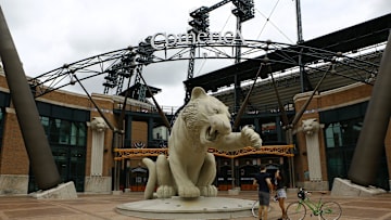 Ed Smith, 33, of Miami, left, and Roberta Souza, 39, of New York talk in front of the big tiger statue during Detroit Tigers' Opening Day at Comerica Park on Monday, July 27, 2020.

0e6a3363 big tiger, tiger statue, empty, Comerica Park logo, Comerica Park entrance