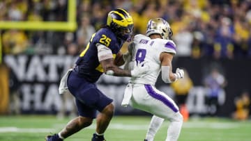 Michigan linebacker Junior Colson tackles Washington running back Will Nixon during the second half