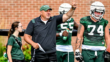 Michigan State's offensive line coach Jim Michalczik works with the team during the first day of football camp on Tuesday, July 30, 2024, in East Lansing.
