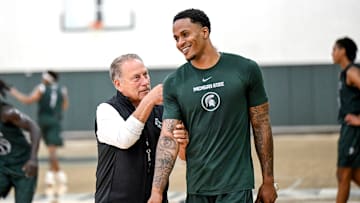 Michigan State's coach Tom Izzo, left, jokes with injured transfer Kaleb Glenn during the first day of basketball practice on Monday, Sept. 22, 2025, at the Breslin Center in East Lansing.