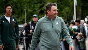 Michigan State's head coach Jonathan Smith walks past fans before the football game against Boston College on Saturday, Sept. 6, 2025, at Spartan Stadium in East Lansing.