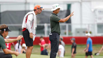 Zecheng Dou lines up using the AimPoint technique before putting on the 18th green during the third round of the Rocket Mortgage Classic at Detroit Golf Club in Detroit on Saturday, July 1, 2023.