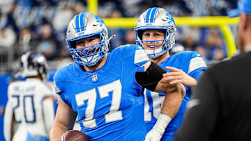 Detroit Lions quarterback Jared Goff talks to center Frank Ragnow before the Tennessee Titans game at Ford Field
