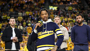 Trey Burke speaks during halftime as Michigan honors the 10-year anniversary of the 2013 run to the Final Four and national title game 