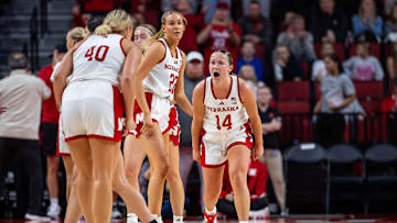 Nebraska basketball guard Callin Hake (14) celebrates with forward Alexis Markowski (40) against Southeastern Louisiana.