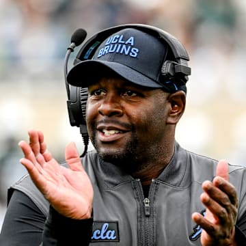 UCLA's interim head coach Tim Skipper celebrates after a Bruins touchdown against Michigan State during the third quarter on Saturday, Oct. 11, 2025, at Spartan Stadium in East Lansing.