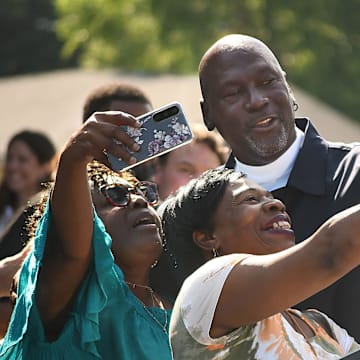 Michael Jordan takes a few photos with friends outside of The Michael Jordan Family Medical Clinic led by Novant Health. After taking part in a ribbon cutting ceremony for the new clinic opening off of Greenfield Street Tuesday May 7, 2024 in Wilmington, N.C. KEN BLEVINS/STARNEWS