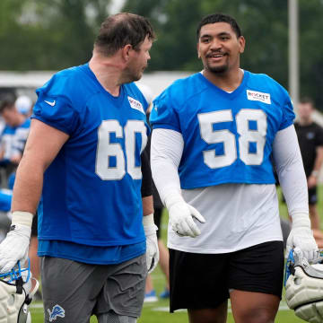 Detroit Lions Graham Glasgow and Penei Sewell.