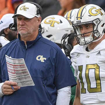 Nov 11, 2023; Clemson, South Carolina, USA; Georgia Tech Yellow Jackets quarterback coachChris Weinke and quarterback Haynes King (10) look on during the fourth quarter against the Clemson Tigers at Memorial Stadium. Mandatory Credit: Ken Ruinard-Imagn Images