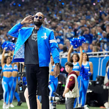 Detroit Lions great Calvin Johnson hypes up the crowd during the first quarter against the Washington Commanders in the NFC divisional round at Ford Field in Detroit on Saturday, Jan. 18, 2025.